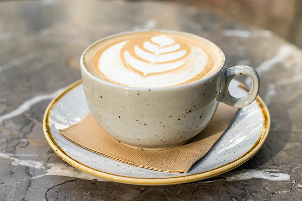 cappuccino-white-coffee-cup-with-heart-shape-art-2024-12-10-01-18-55-utc