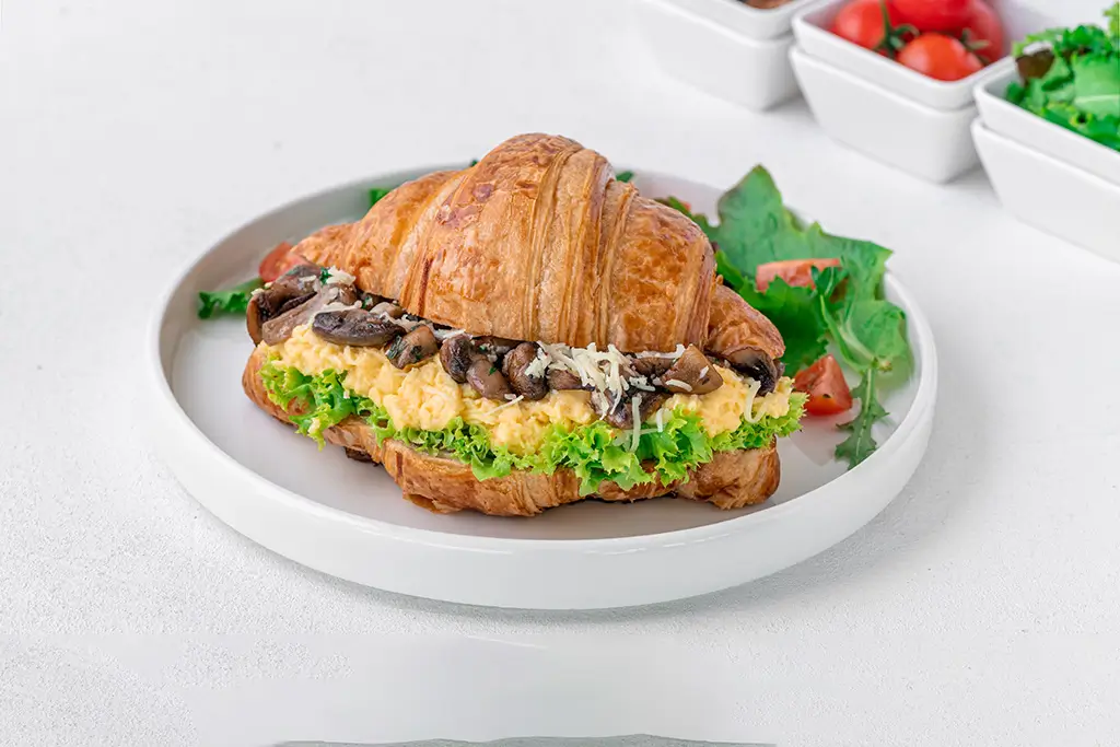 croissant-sandwich-with-mushrooms-and-lettuce-on-a-2025-02-03-04-54-35-utc