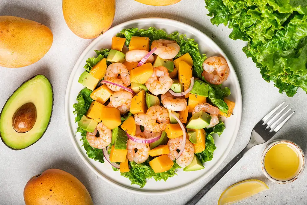 salad-with-mango-shrimp-and-avocado-on-white-plat-2024-10-20-00-38-43-utc (1)