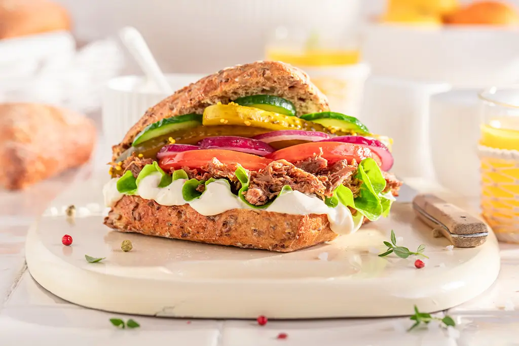 tasty-sandwich-served-with-lemonade-in-the-kitchen-2025-03-24-04-00-08-utc