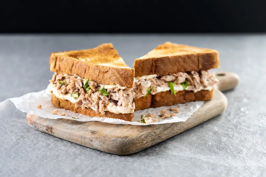 tuna-sandwich-with-mayo-and-vegetables-on-gray-sto-2025-06-05-20-59-29-utc